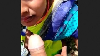 Indian beauty delivers a passionate oral sex performance outdoors