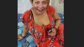 A mature Desi woman performs as a high-quality sex worker in a video