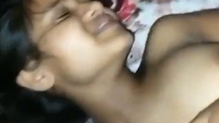 A young woman from Guwahati enjoys a passionate encounter with her lover, who skillfully explores her shaved and eager pussy, while she reciprocates with sweet moans of pleasure.