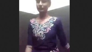 A young Indian woman reveals her body as she removes her clothing on camera