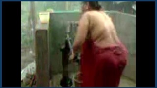 Desi aunty bathes at the well