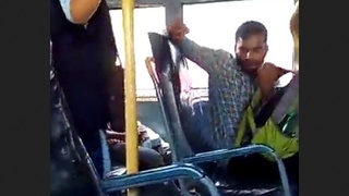 A man masturbates on a public bus while the female conductor records him