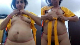 Indian aunt displays her breasts and vagina
