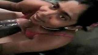 A sultry Indian woman giving oral pleasure to a man