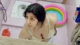 Indian village sister bathes and urinates while her mom watches