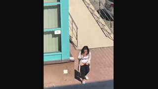 A black woman pleasuring herself outdoors