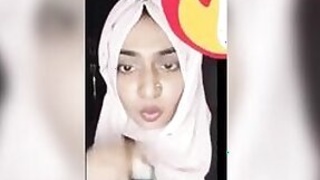 Girl Hijabi Desi plays with her plump pussy on camera