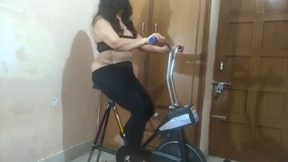 A Pakistani wife with a large buttocks exercises and becomes aroused on a treadmill