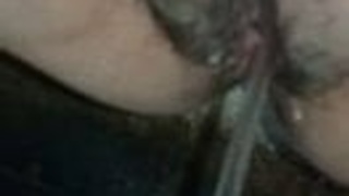 A woman relieves herself on camera