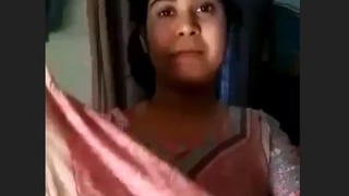 A stunning pie undresses and tempts her partner in a striped outfit