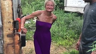 Outdoor interracial action featuring an older woman