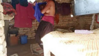 Village girl filmed while getting dressed after a bath