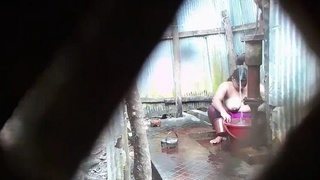 Indian wife's outdoor shower scenes captured on film