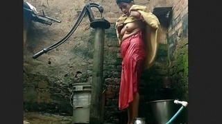 Indian aunty's open-air bathing