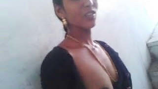 A South Indian wife proudly displays her large breasts