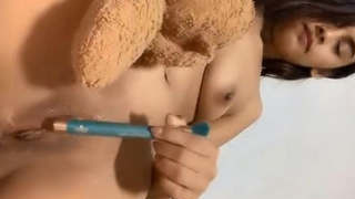 Adorable girl pleasuring herself with her fingers