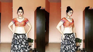 A seductive Indian beauty performs an enticing dance routine