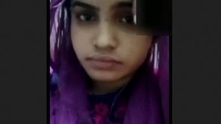 A stunning and adorable girl displays herself