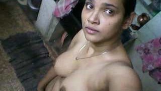 Young and charming Indian girl undressed for a bath