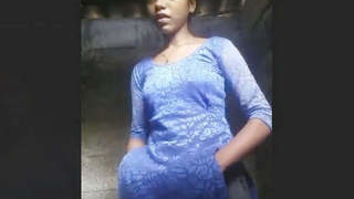 A young woman from a rural area takes a bath and films herself