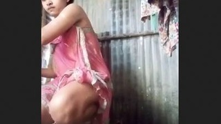 Indian wife's open-air bath in the countryside
