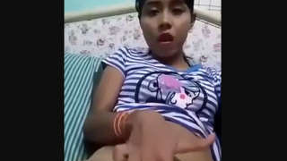 A South Asian woman misbehaves on her husband's bed, flaunting her physique