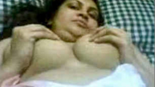 South Asian woman reveals her breasts and vagina