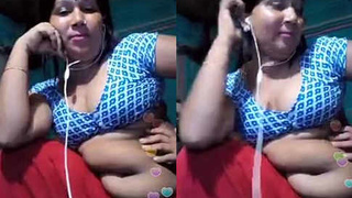 Aunt with a large belly talks on webcam