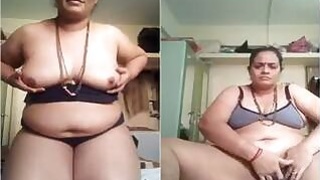 Horny Desi Bhabhi Sucking her tits and jerking off with her fingers