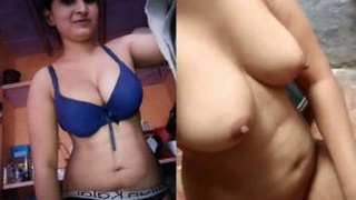 A sultry and extremely attractive woman records a nude selfie for her partner, emphasizing her sensuality and allure.
