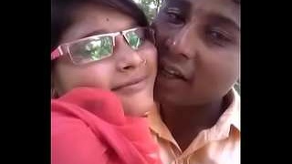 Indian sweethearts share a passionate kiss outdoors