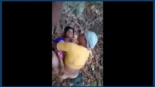 Young girl engages in sexual activity amidst outdoor wilderness
