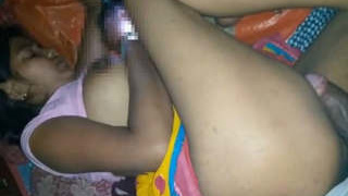 An Indian couple engages in sexual activity while the wife is distracted by her mobile phone