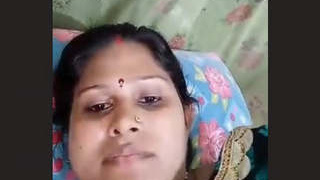 Indian aunty reveals her large breasts while taking a bath