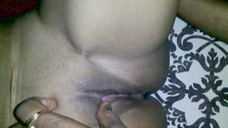 A sultry Indian wife enjoys penetrative sex