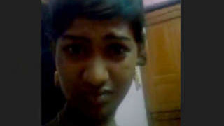 Attractive woman displays breasts and genitals in a live performance