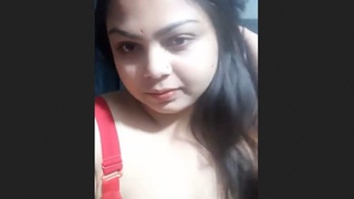 Gorgeous Desi woman with large breasts teases and uncovers