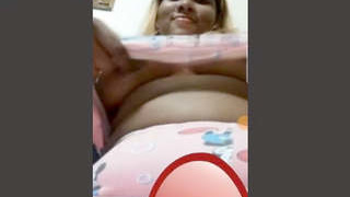 Attractive girlfriend displays her large breasts over video call