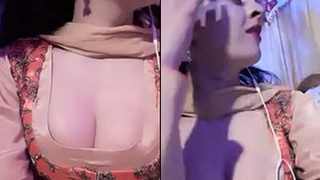 Married woman's cleavage and breasts on display at wedding celebration